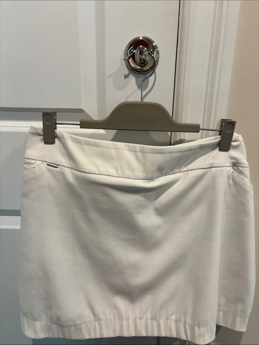 Classic White EP golf  Skirt with silver accents and side and back pockets.